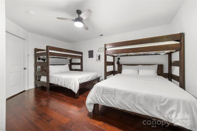 a front view of a house with plants