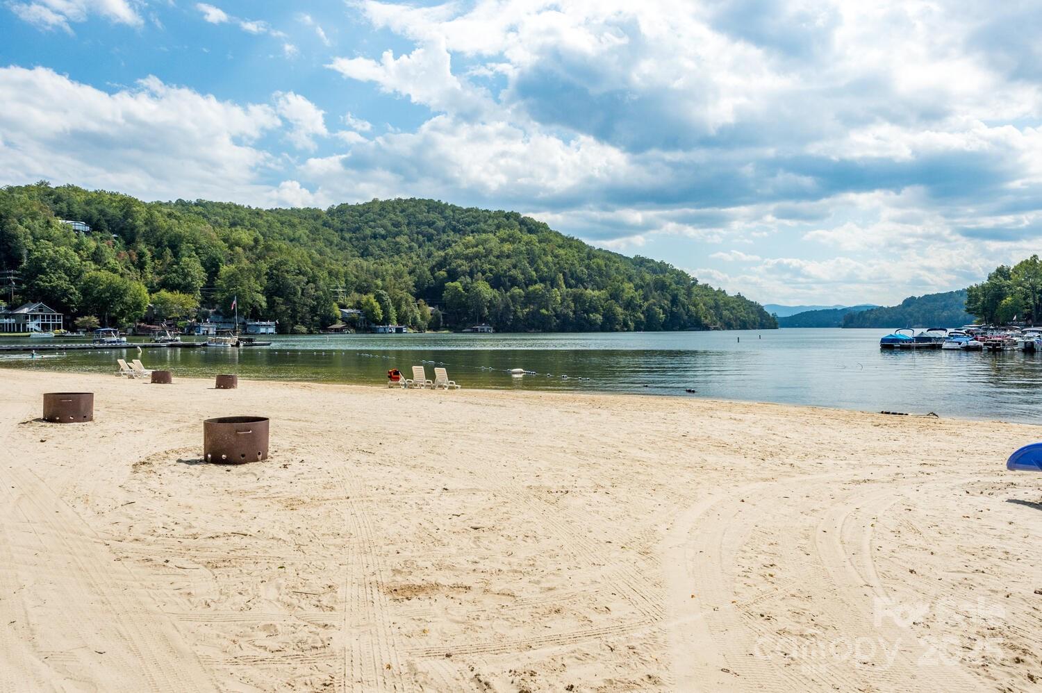 108 June Court Lake Lure, NC 28746 - Photo 40 of 46 a view of a lake with houses in the back