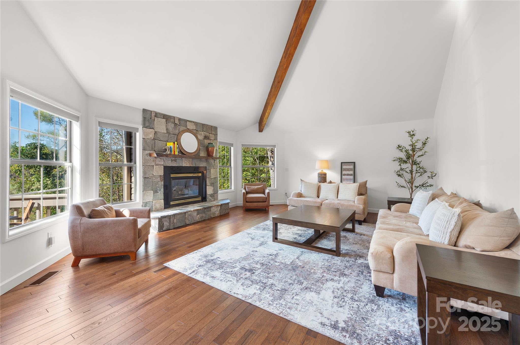 108 June Court Lake Lure, NC 28746 - Photo 4 of 46 a living room with furniture and a fireplace