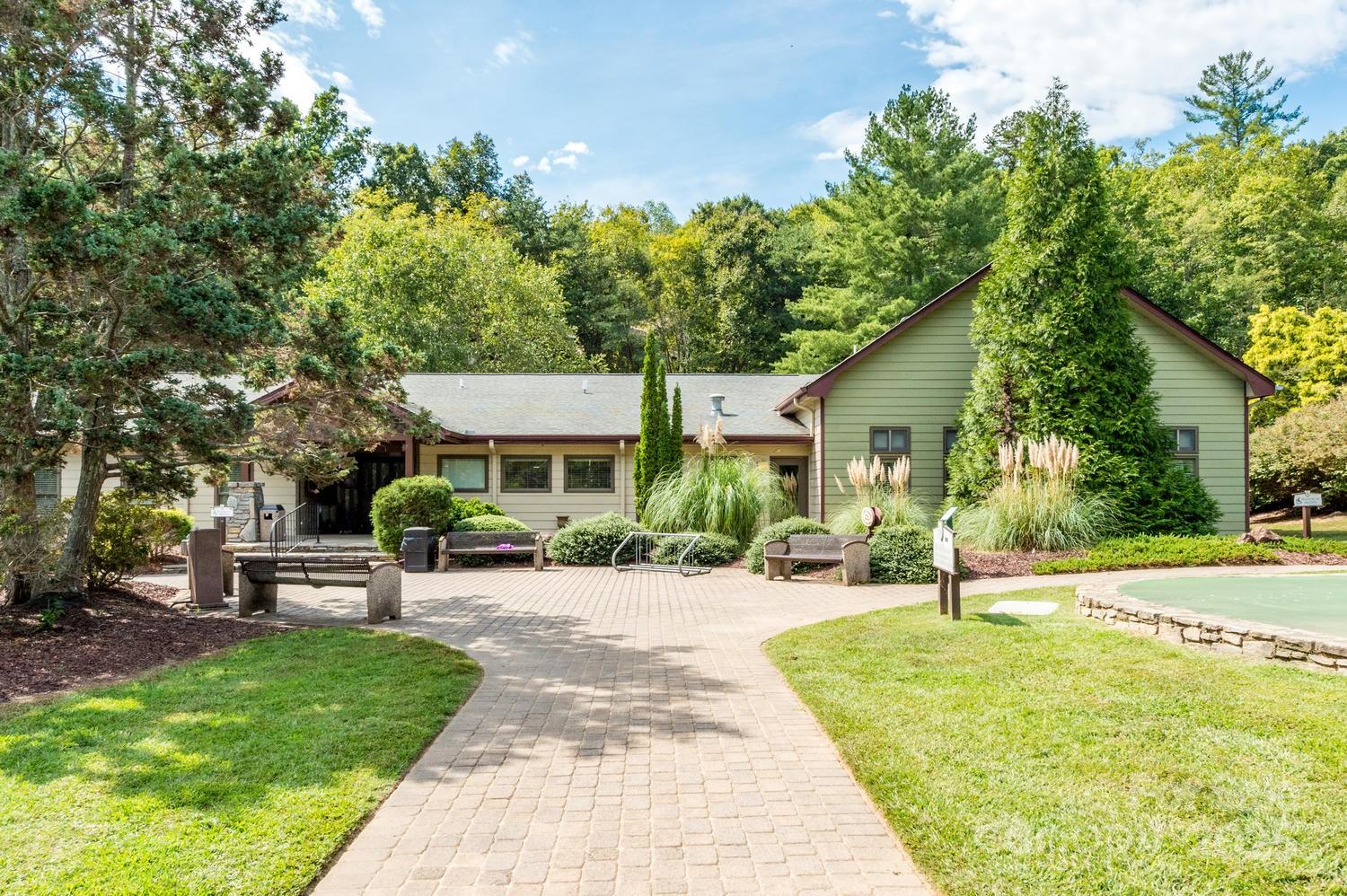 108 June Court Lake Lure, NC 28746 - Photo 45 of 46 a view of a patio with a table and chairs under an umbrella