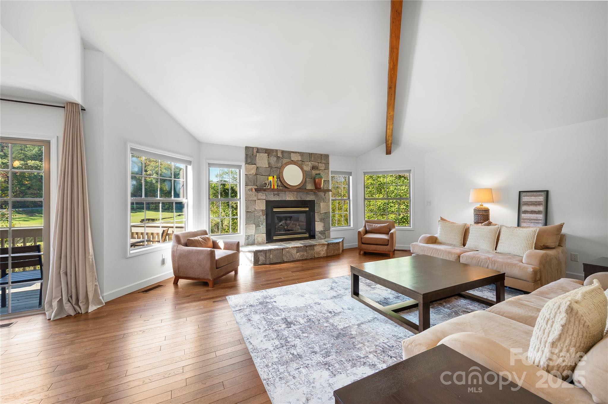 108 June Court Lake Lure, NC 28746 - Photo 5 of 46 a living room with furniture and a fireplace
