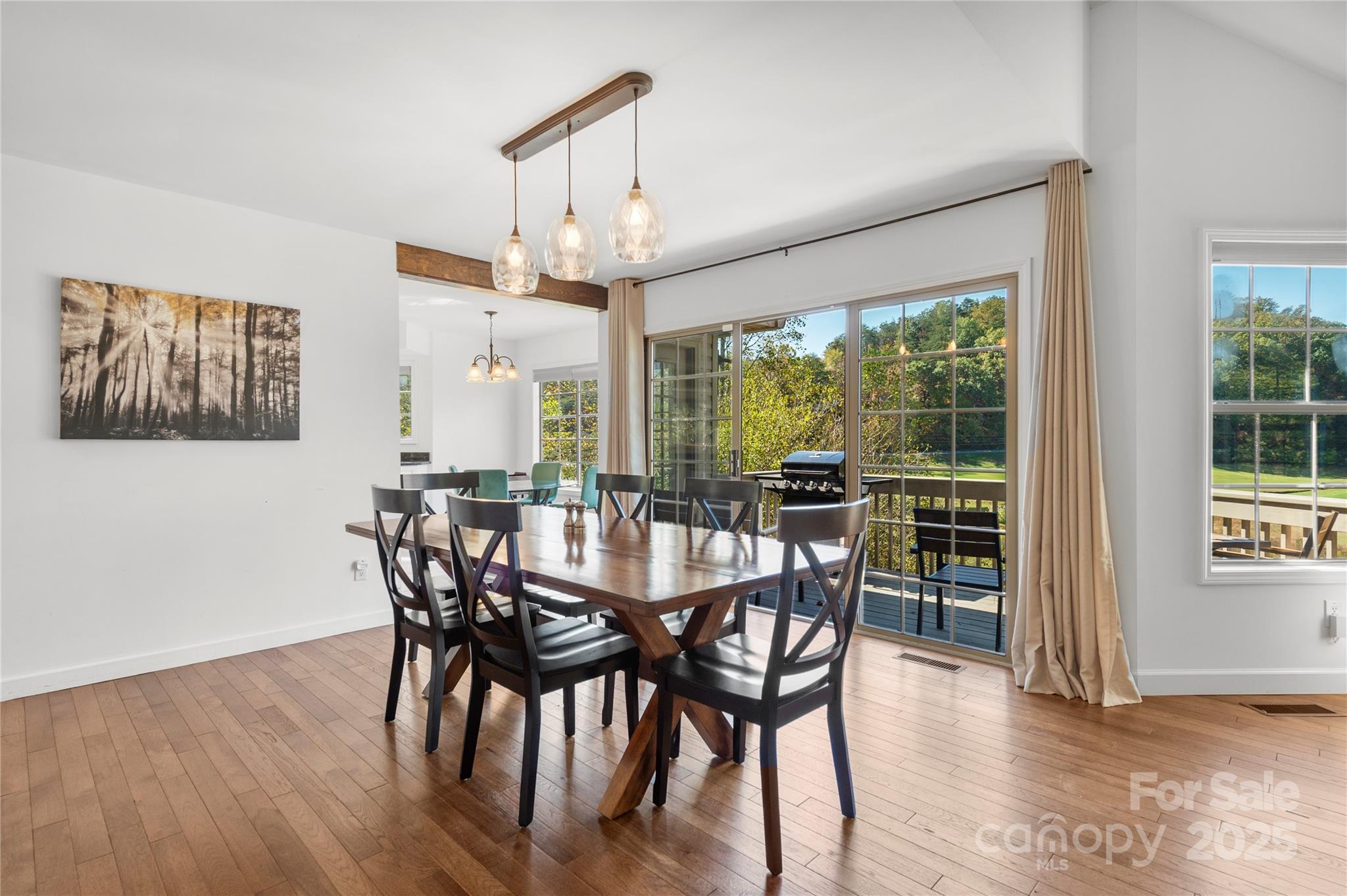 108 June Court Lake Lure, NC 28746 - Photo 6 of 46 a view of a dining room with furniture window and wooden floor