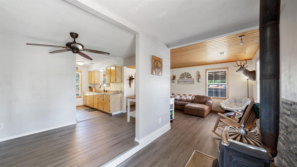 29080 Highway 19 Athens, TX 75752 - Photo 4 of 30 a view of a livingroom with furniture hardwood floor a ceiling fan and windows