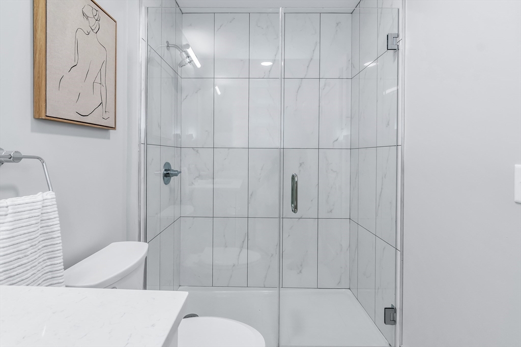 200 Merrimack Street, Unit 201 Haverhill, MA 01830 - Photo 14 of 17 a bathroom with a bathtub and shower