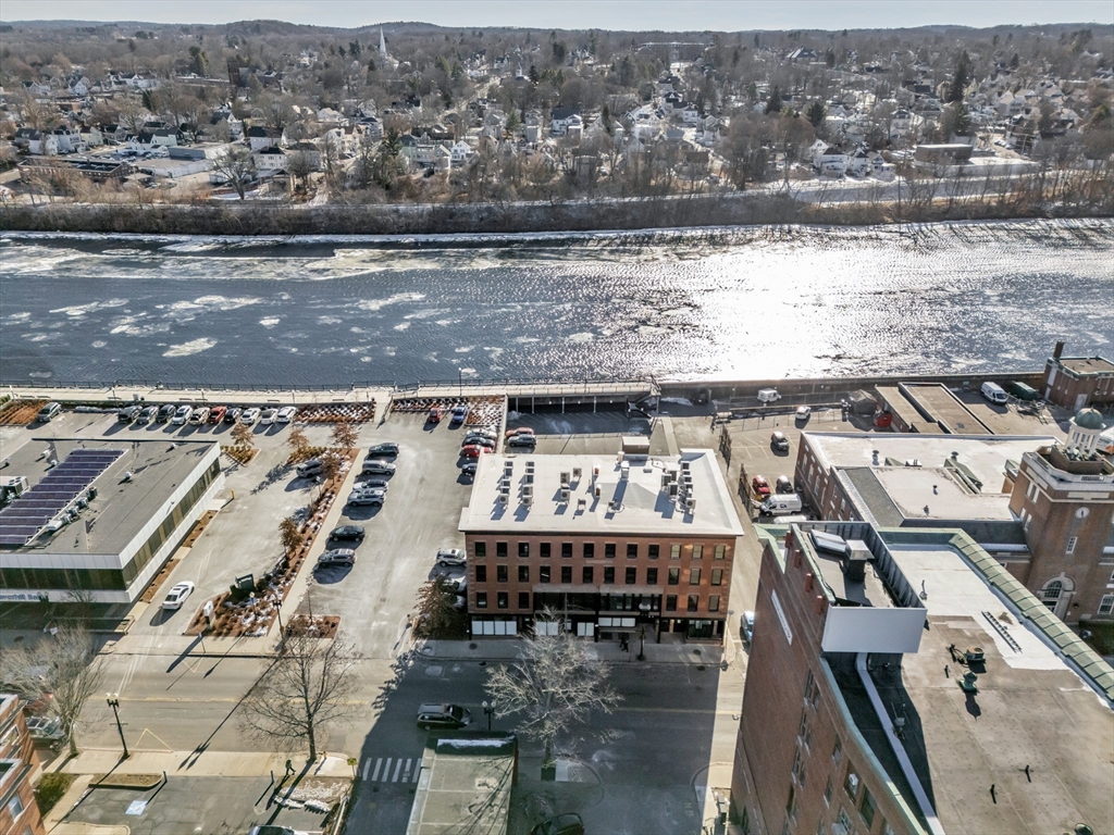 200 Merrimack Street, Unit 201 Haverhill, MA 01830 - Photo 17 of 17 an aerial view of residential houses with outdoor space