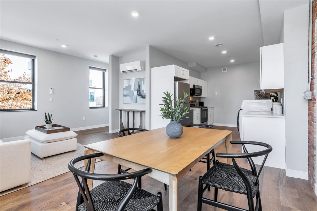 200 Merrimack Street, Unit 201 Haverhill, MA 01830 - Photo 7 of 17 a view of a dining room with furniture and window