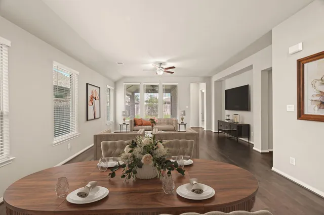 a view of a dining room with furniture window and wooden floor