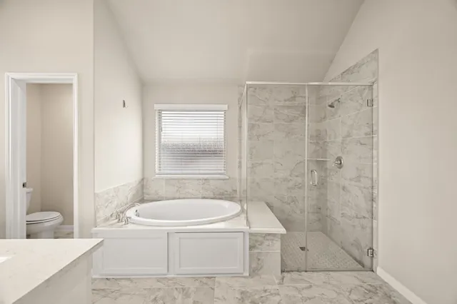 a bathroom with a tub shower and a sink