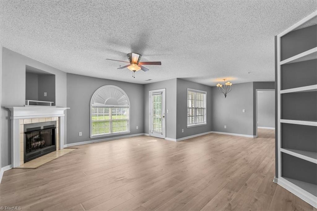 133 James Road, Unit IC High Point, NC 27265 - Photo 17 of 17 Open floorplan with large windows, updated flooring, built-in shelves and fireplace!