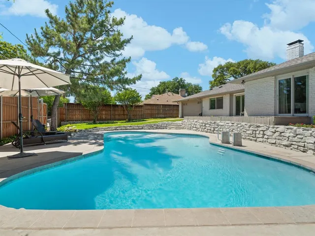 a view of a house with swimming pool
