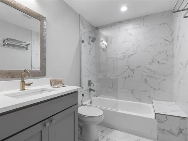 a bathroom with a sink a toilet and a bathtub