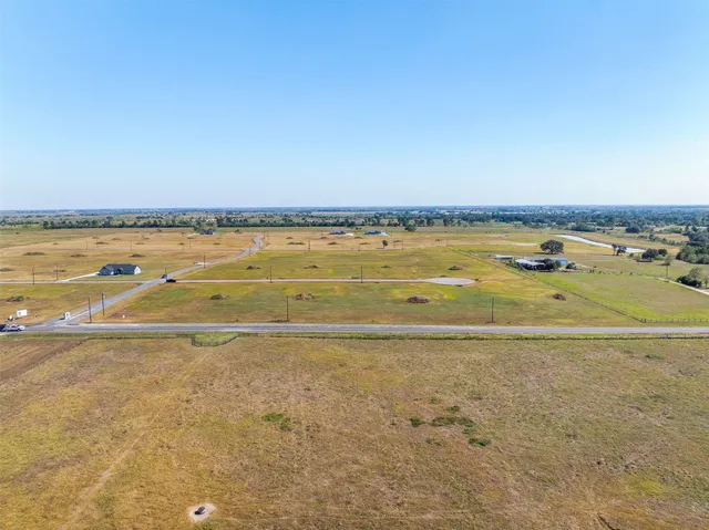 a view of a house with a big yard