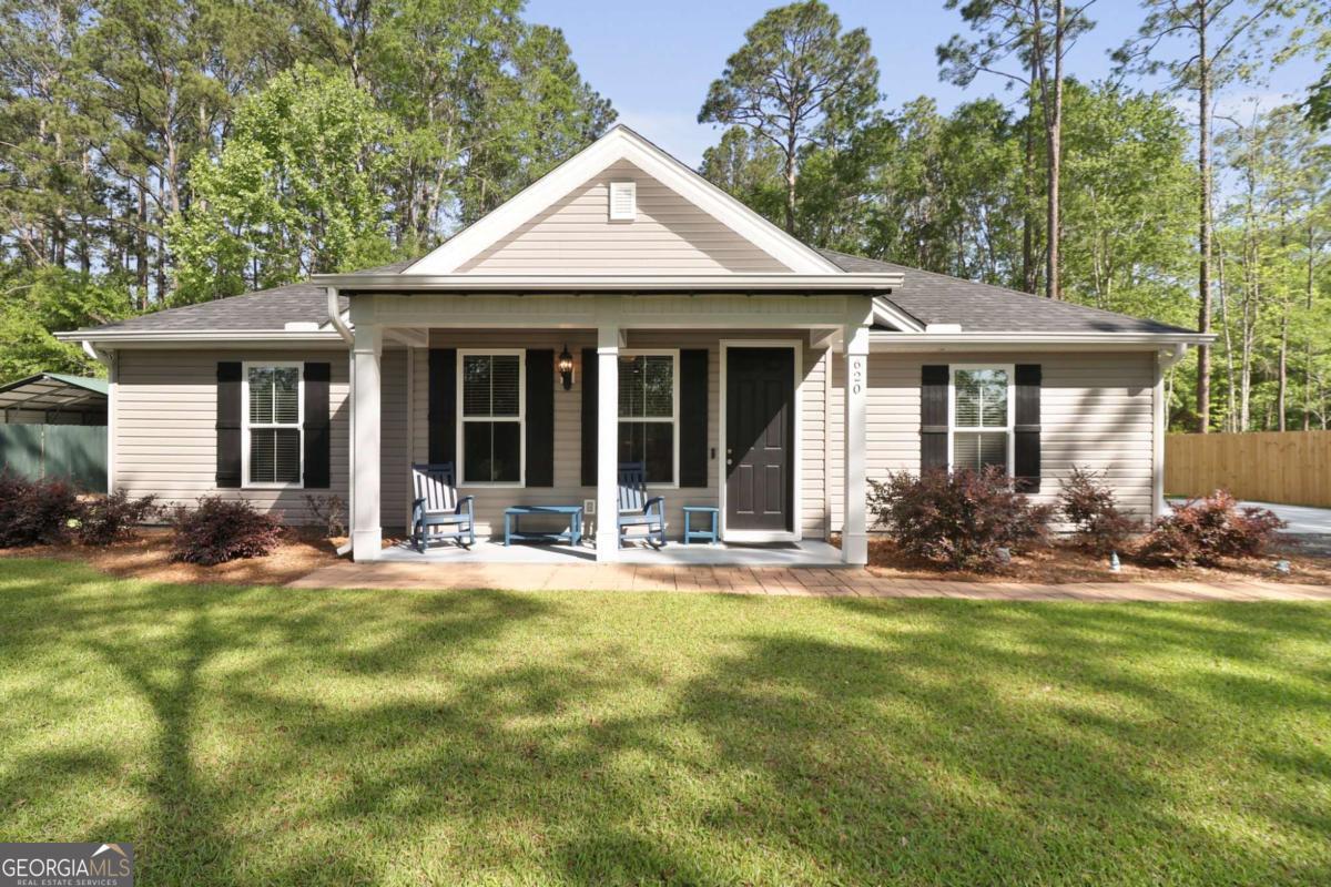 620 West 9th Street Rincon, GA 31326 - Photo 1 of 1 a view of a house with a yard and sitting area