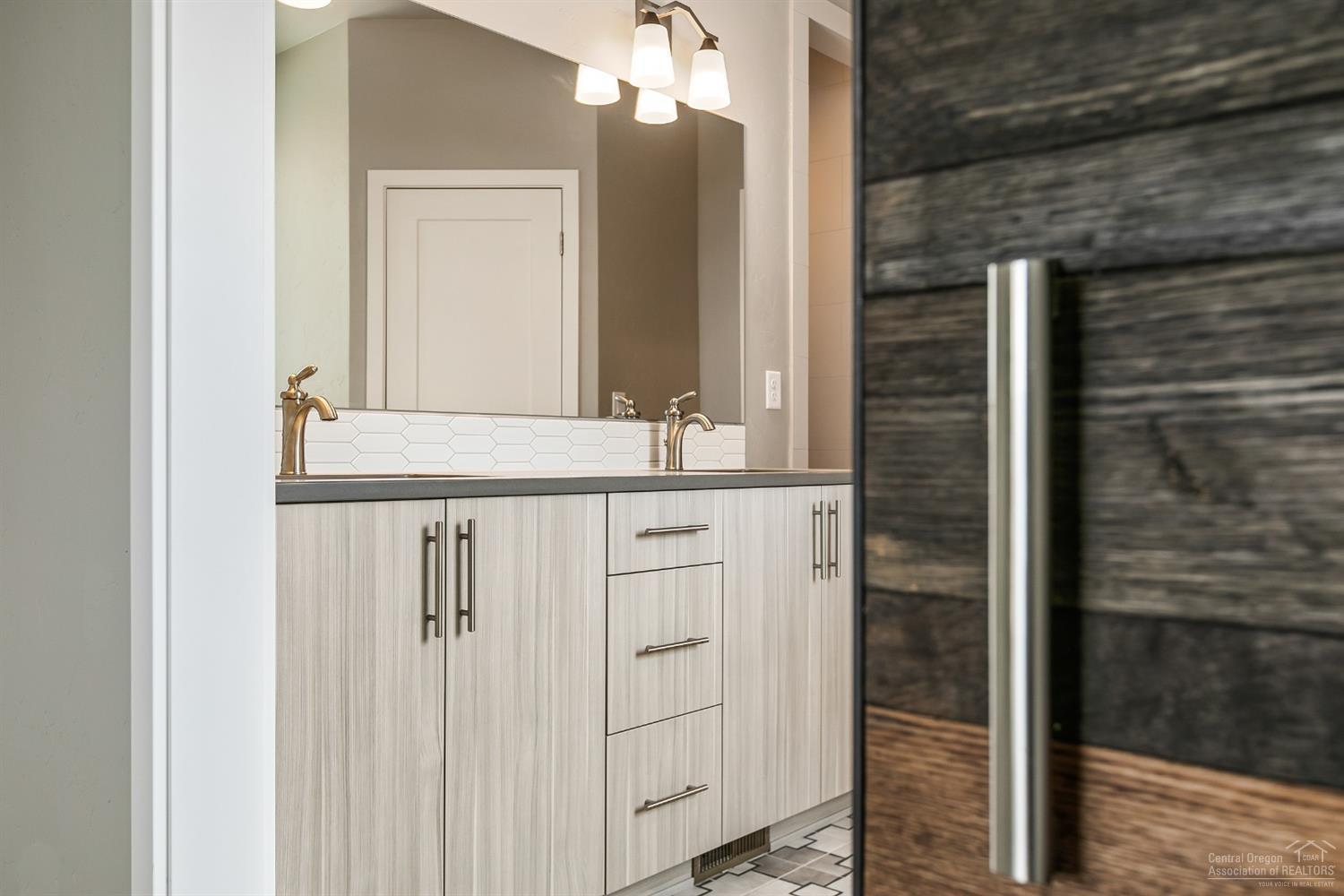 63120 Iner Loop Bend, OR 97701 - Photo 14 of 25 Barn door to Master Bath Pictures are of a similar home.