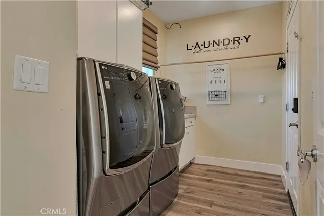 a bedroom with bed and wooden floor