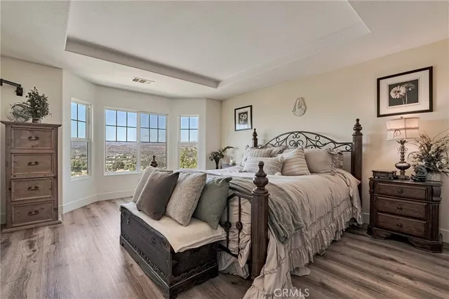a spacious bathroom with a tub sink shower and mirror