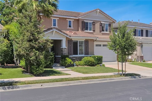 a open kitchen with white cabinets and stainless steel appliances