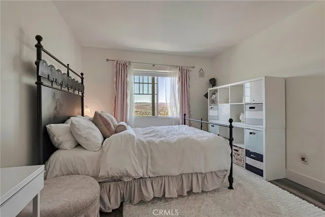 a bedroom with a bed and a closet