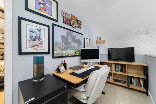 a view of a workspace with furniture