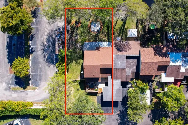 a view of a house with a yard and garden