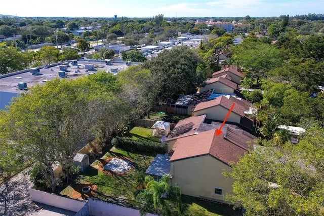 an aerial view of house with yard