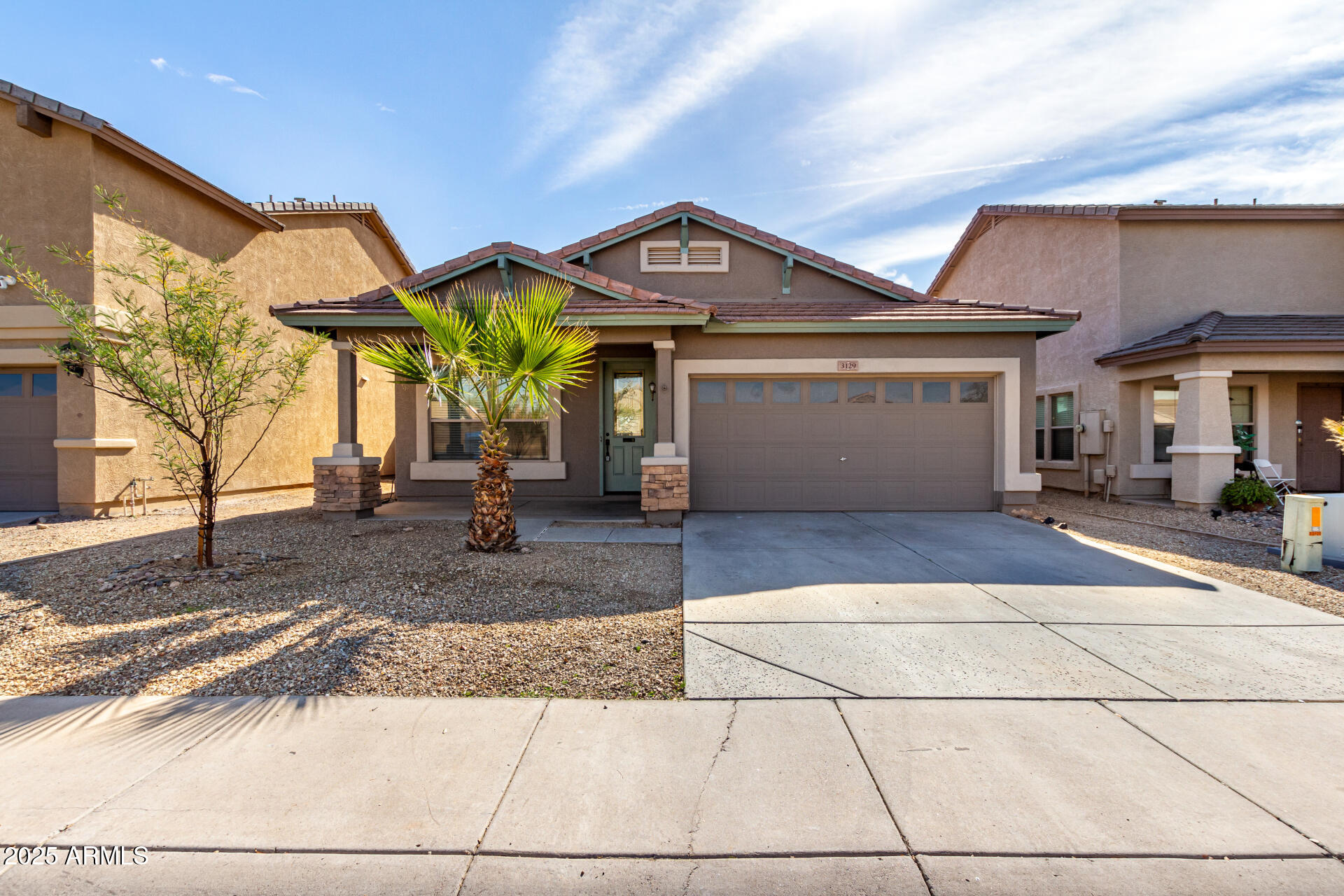 3129 West Fremont Rd. Phoenix, AZ 85041 - Photo 1 of 30 a view of multiple houses with a pathway