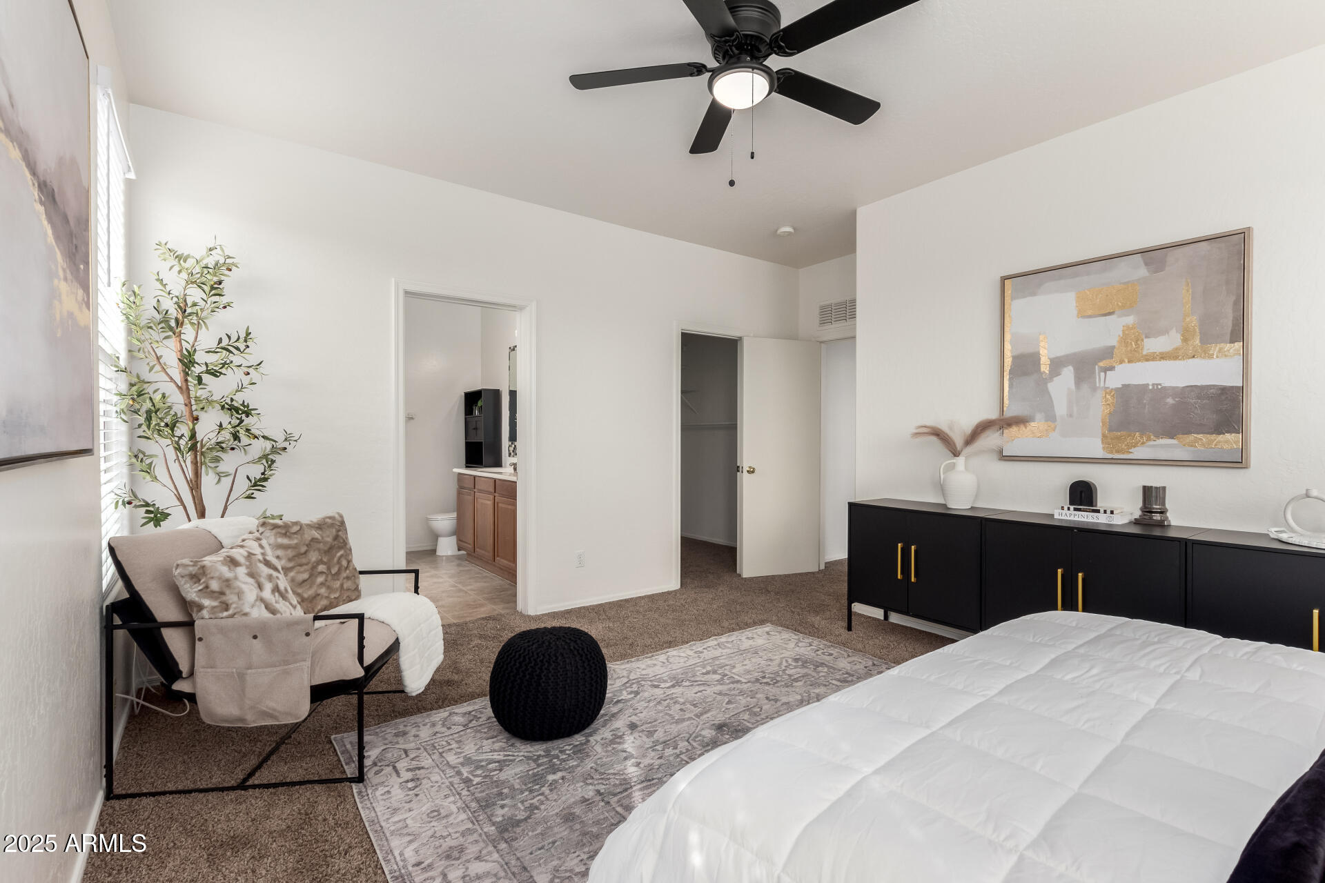 3129 West Fremont Rd. Phoenix, AZ 85041 - Photo 14 of 30 a bedroom with a bed and wooden floor