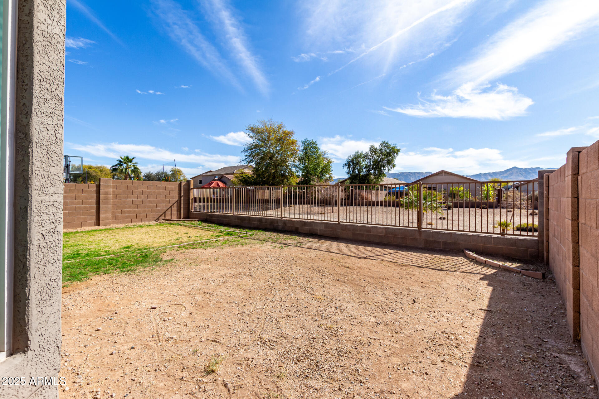 3129 West Fremont Rd. Phoenix, AZ 85041 - Photo 23 of 30 a view of a pathway with a wrought fence