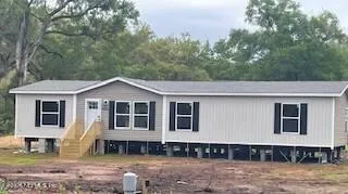 a house with trees in the background