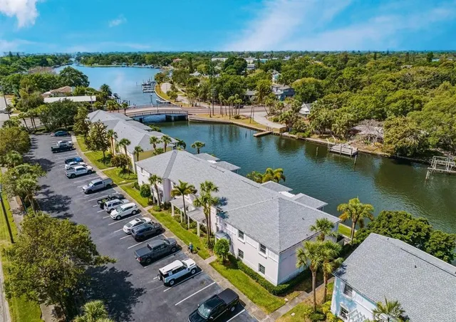 an aerial view of a house with a lake view