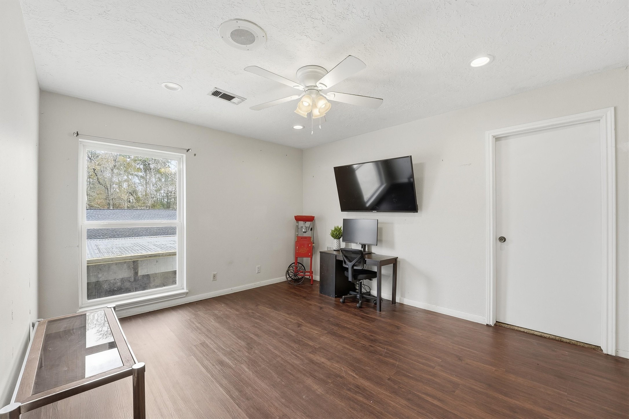 17663 Gardenia Lane New Caney, TX 77357 - Photo 13 of 37 a view of a livingroom with furniture and a flat screen tv