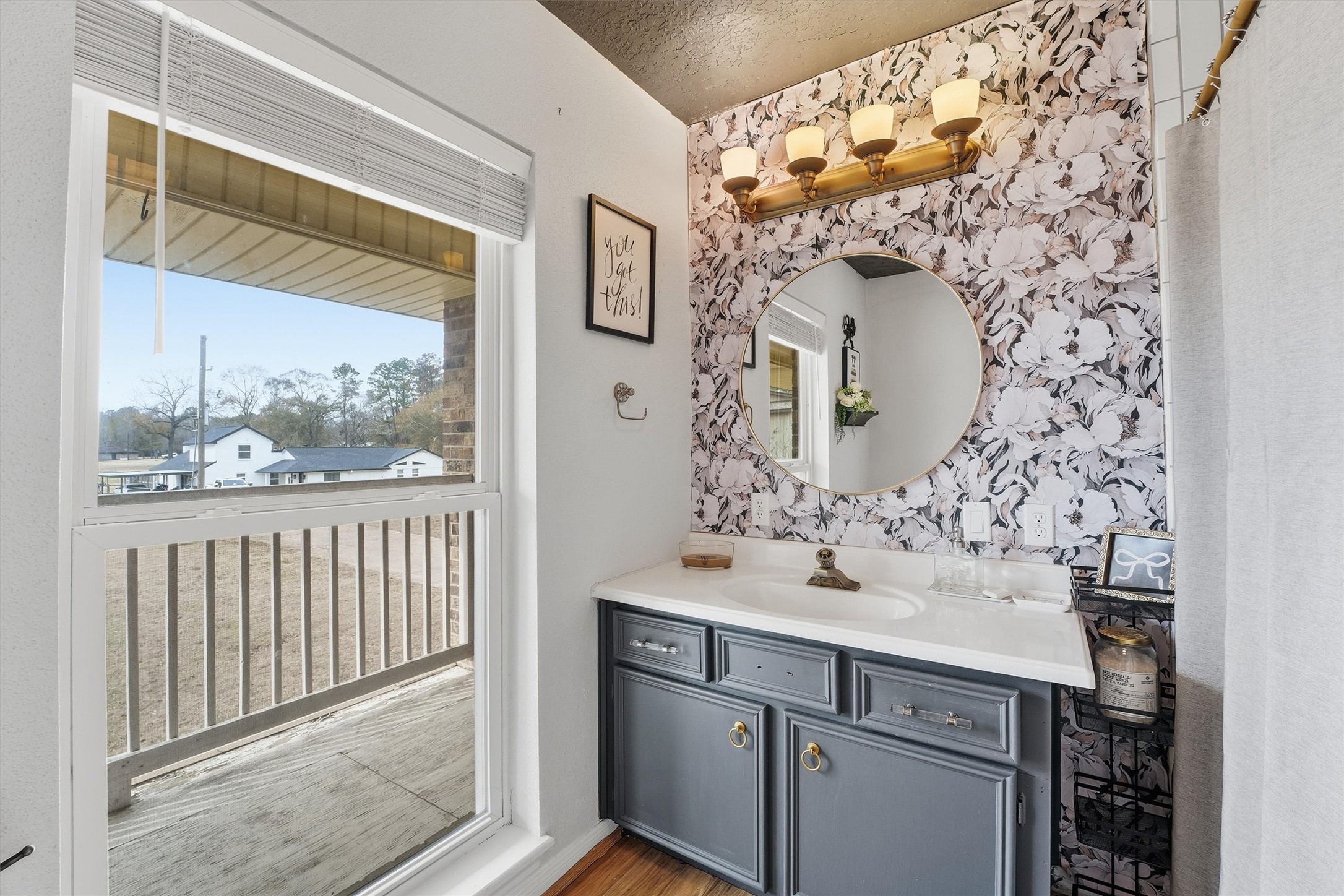 17663 Gardenia Lane New Caney, TX 77357 - Photo 14 of 37 a bathroom with a sink and a mirror