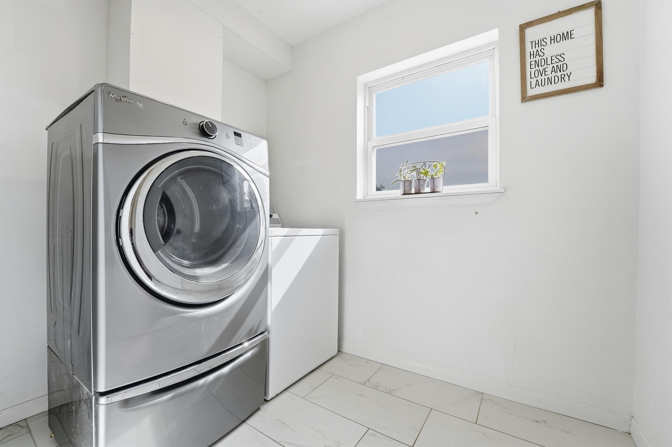 17663 Gardenia Lane New Caney, TX 77357 - Photo 19 of 37 a utility room with dryer and washer