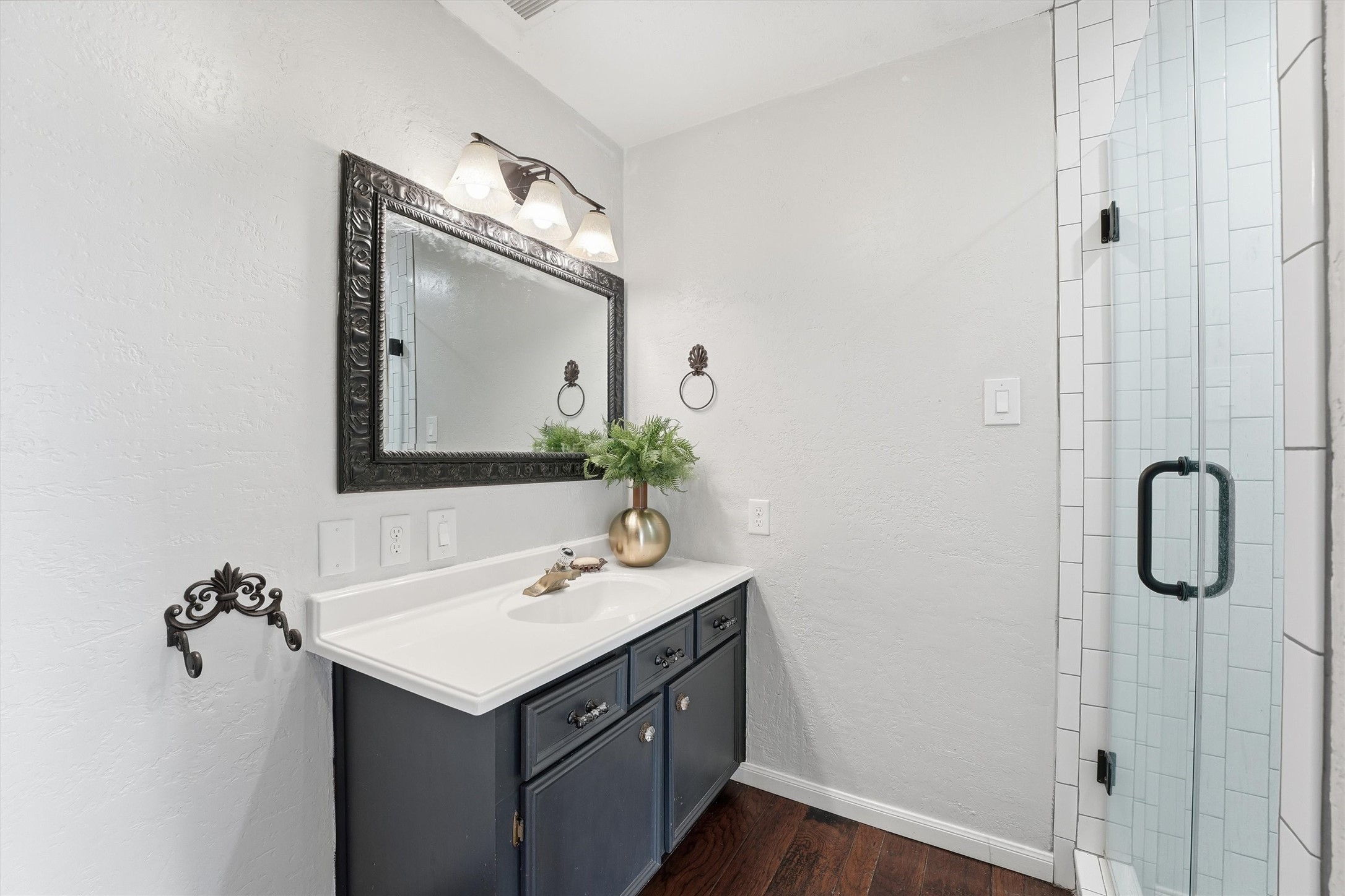 17663 Gardenia Lane New Caney, TX 77357 - Photo 20 of 37 a bathroom with a sink vanity and a mirror