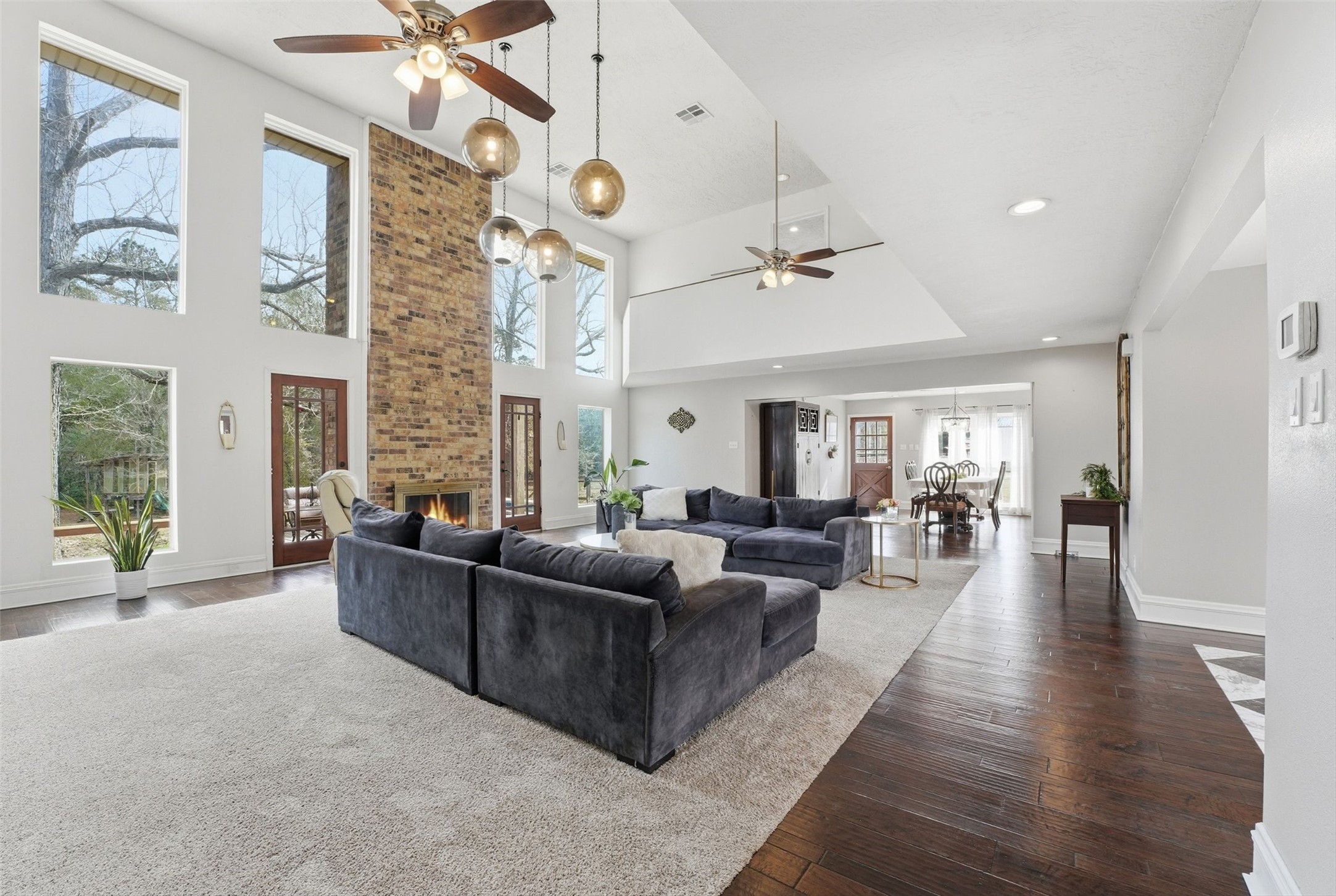 17663 Gardenia Lane New Caney, TX 77357 - Photo 3 of 37 a living room with furniture and a fireplace