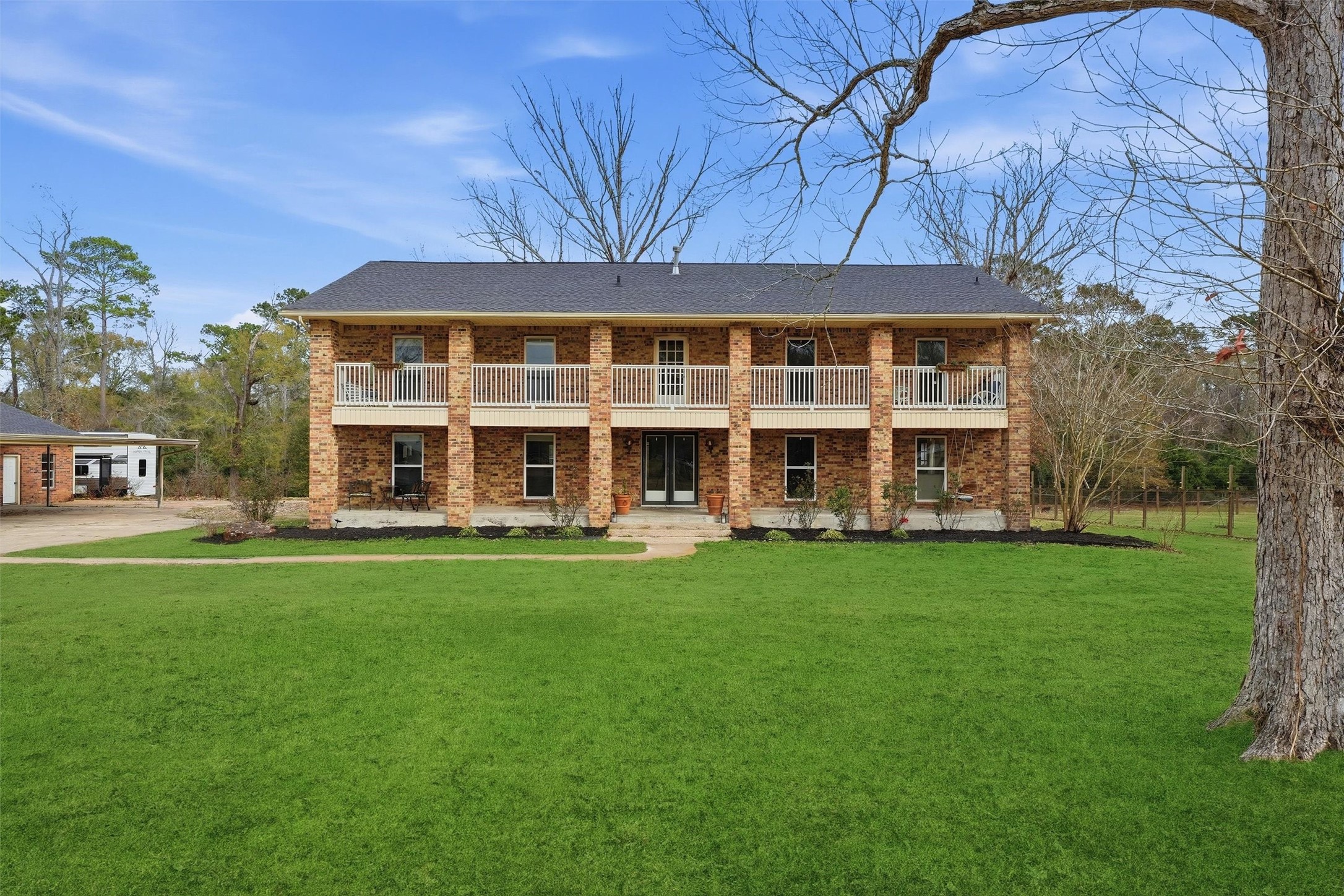17663 Gardenia Lane New Caney, TX 77357 - Photo 34 of 37 a view of a house with a backyard