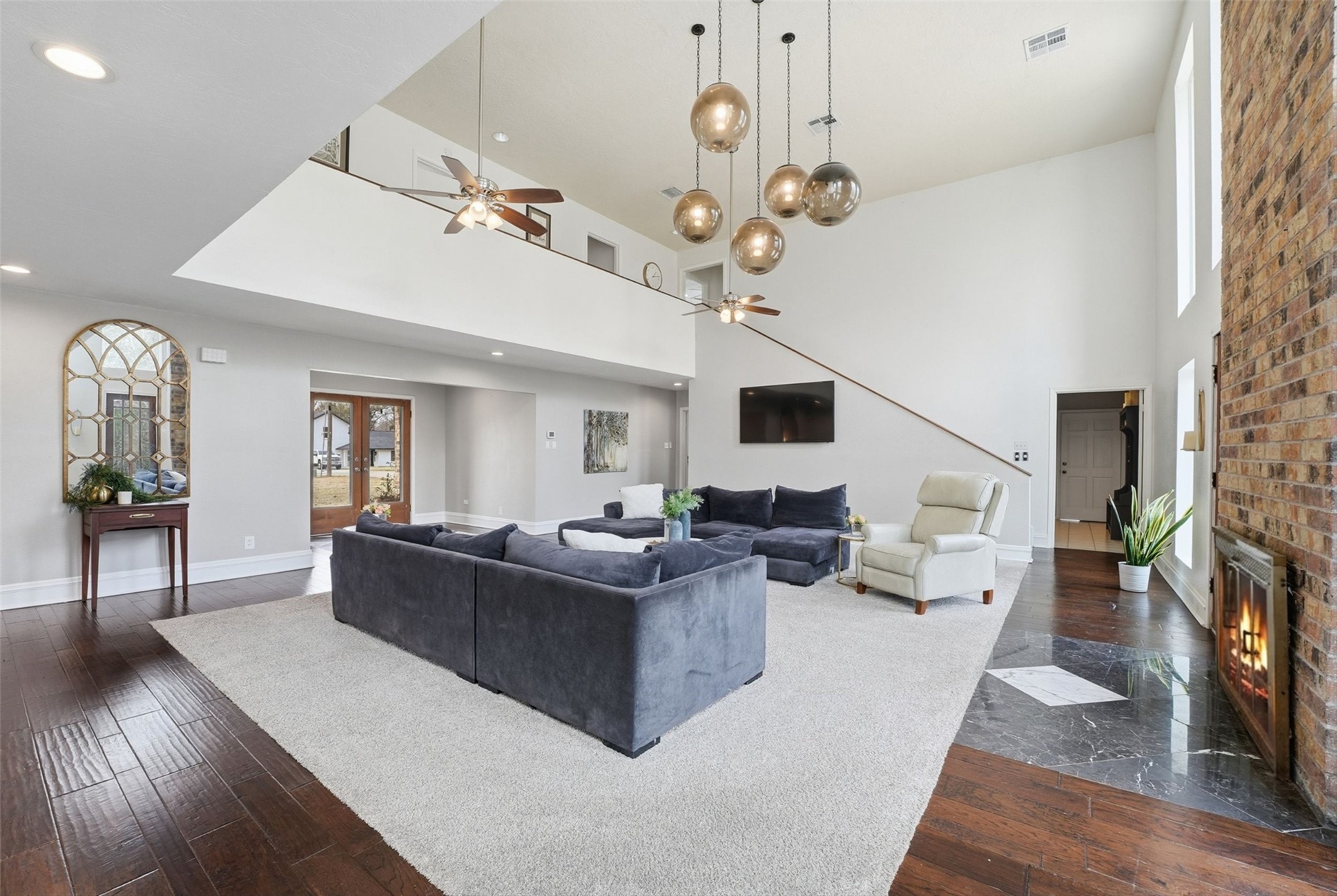 17663 Gardenia Lane New Caney, TX 77357 - Photo 4 of 37 a living room with fireplace furniture and a wooden floor