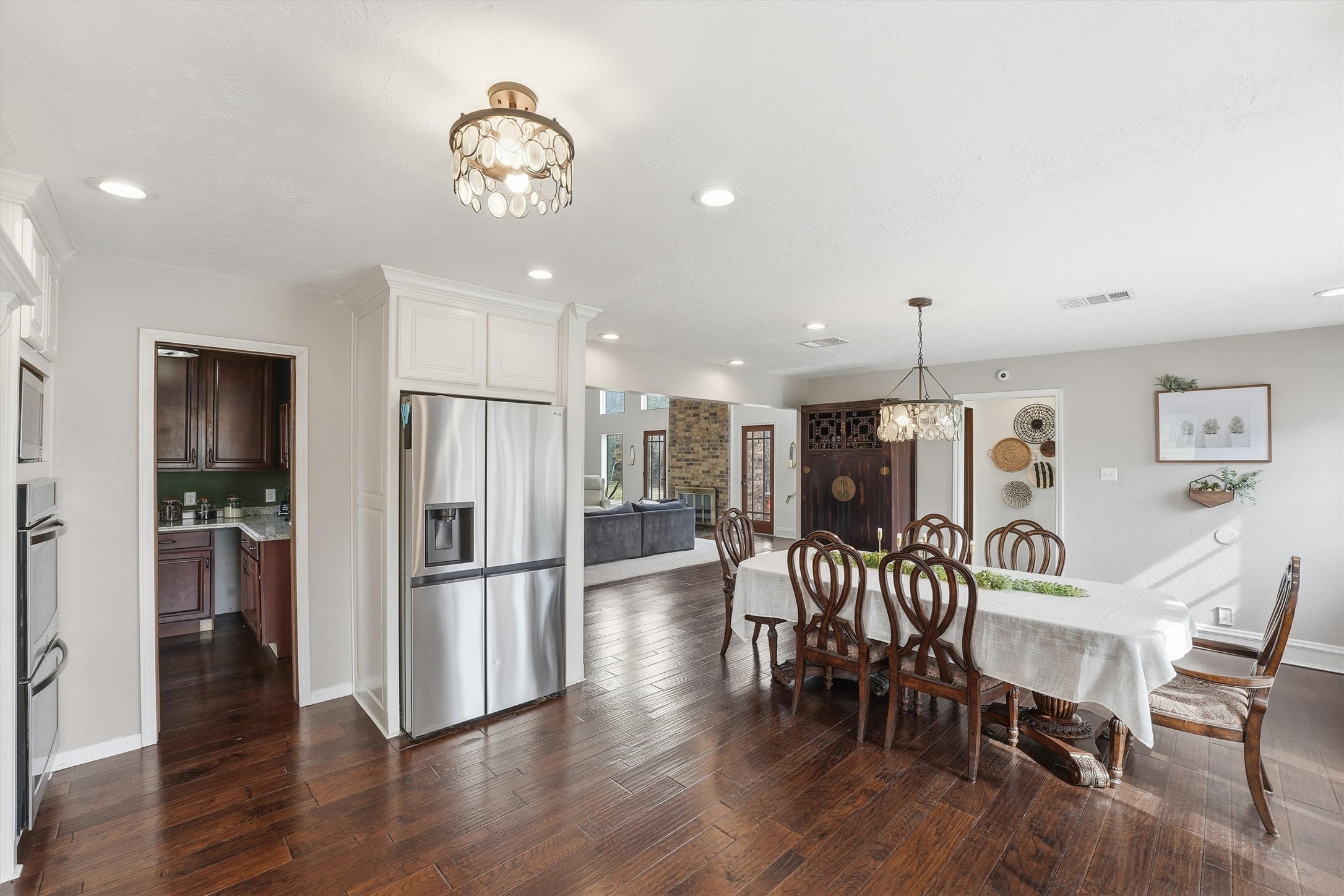 17663 Gardenia Lane New Caney, TX 77357 - Photo 6 of 37 a view of a dining room with furniture wooden floor and chandelier