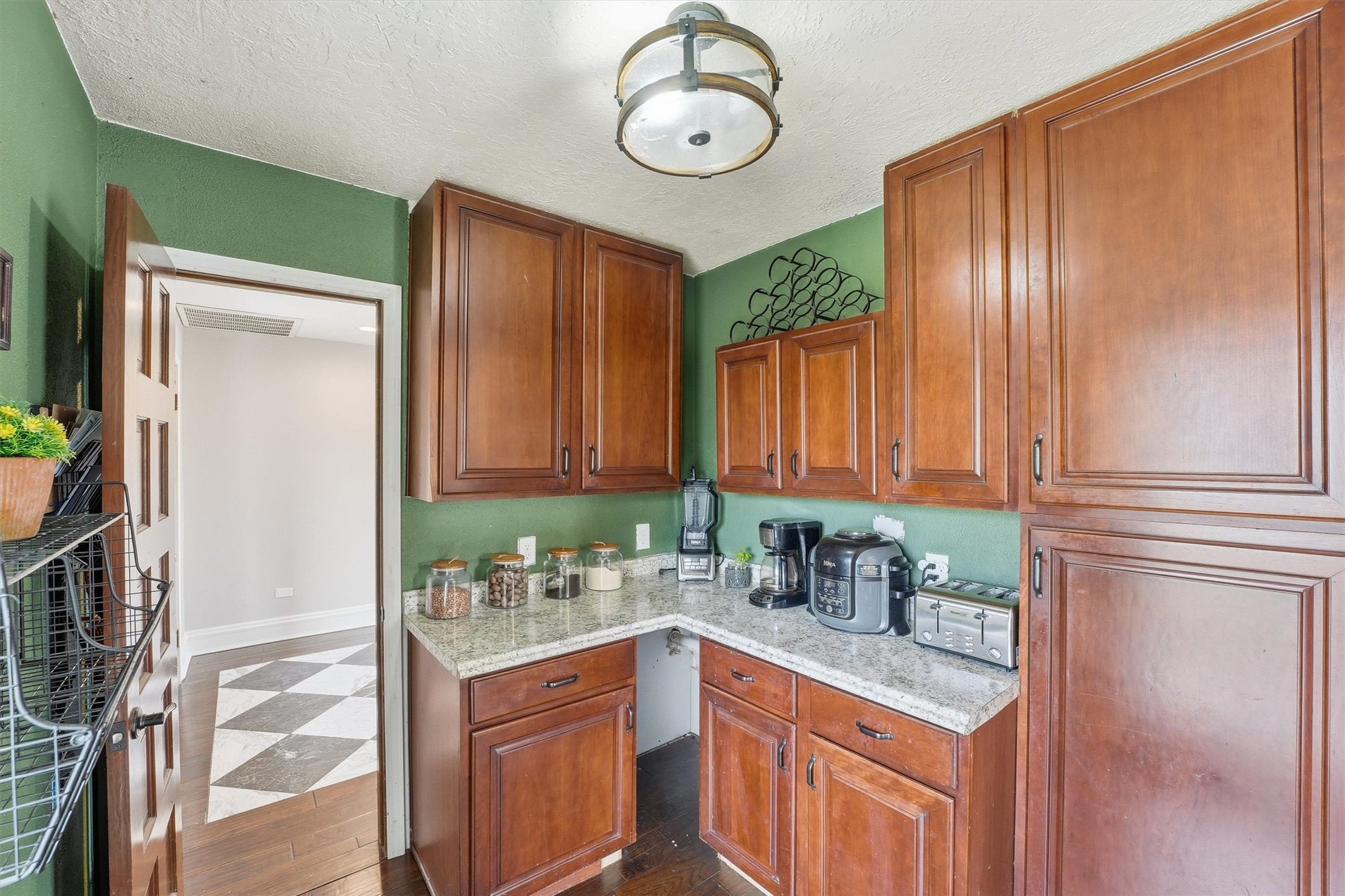 17663 Gardenia Lane New Caney, TX 77357 - Photo 7 of 37 a kitchen with stainless steel appliances granite countertop a sink a stove and a refrigerator with wooden floor
