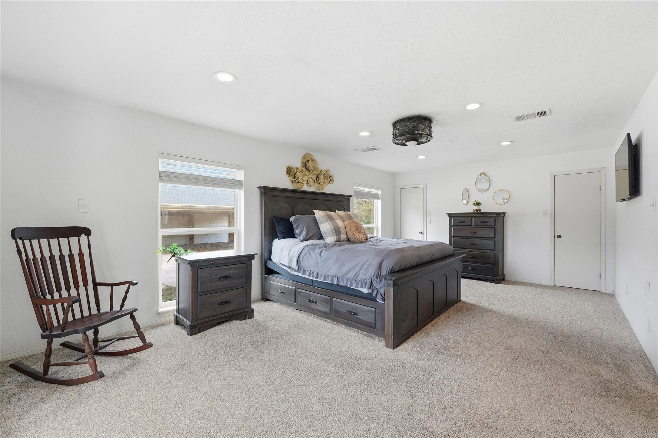 17663 Gardenia Lane New Caney, TX 77357 - Photo 9 of 37 a spacious bedroom with a bed and a cabinets