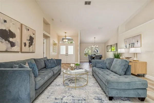 a view of a dining room with furniture window and wooden floor