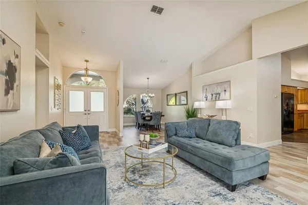 a living room with furniture and a large window