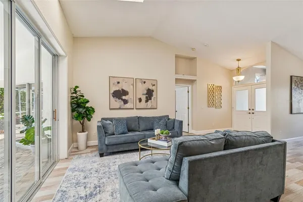 a kitchen with refrigerator and cabinets