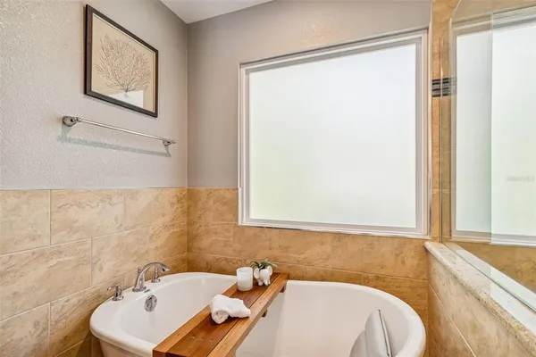 a view of a livingroom with furniture window and wooden floor