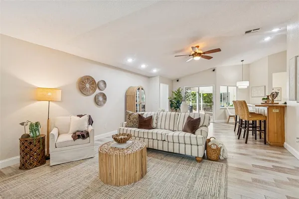 a view of washer and dryer with kitchen in the background