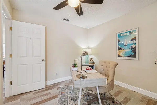 a view of a house with a yard porch and sitting area