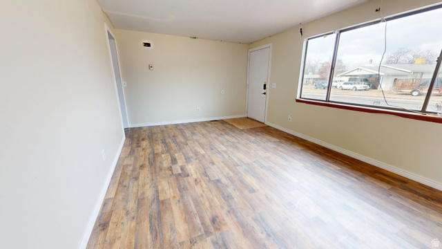 1348 Sagewood Road Price, UT 84501 - Photo 5 of 34 Spare room featuring baseboards and light wood-style floors