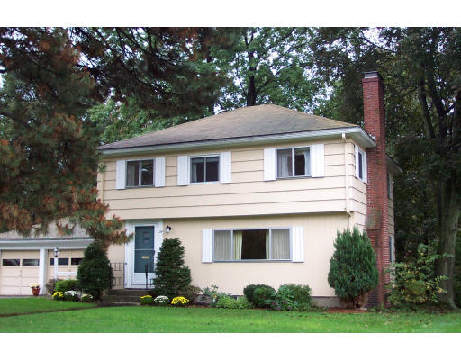 24 Longfellow Road Needham, MA 02494 - Photo 1 of 10 a front view of a house with a yard