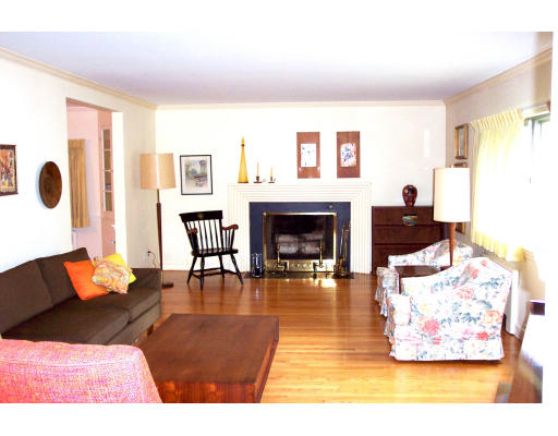 24 Longfellow Road Needham, MA 02494 - Photo 2 of 10 a living room with furniture and a fireplace