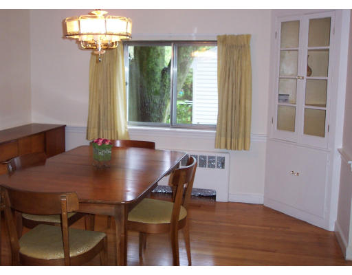 24 Longfellow Road Needham, MA 02494 - Photo 3 of 10 a view of a dining room with furniture and a chandelier